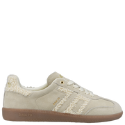 Side view of cream sherpa retro sneaker featuring gold details