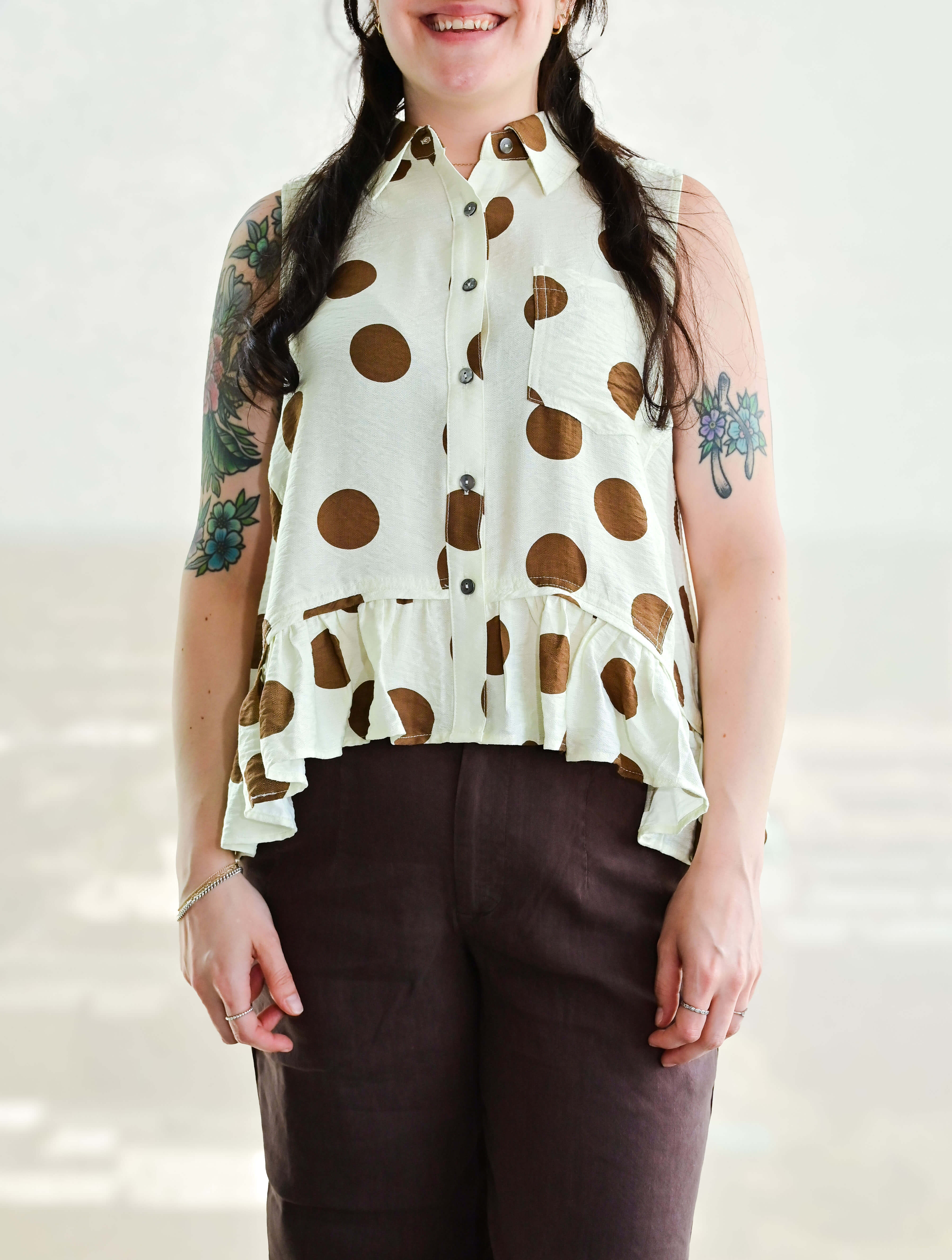 Polka Dot Sleeveless Button Up Blouse With Ruffle Hem