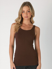 Woman in a fitted chocolate brown tank top with scoop neckline